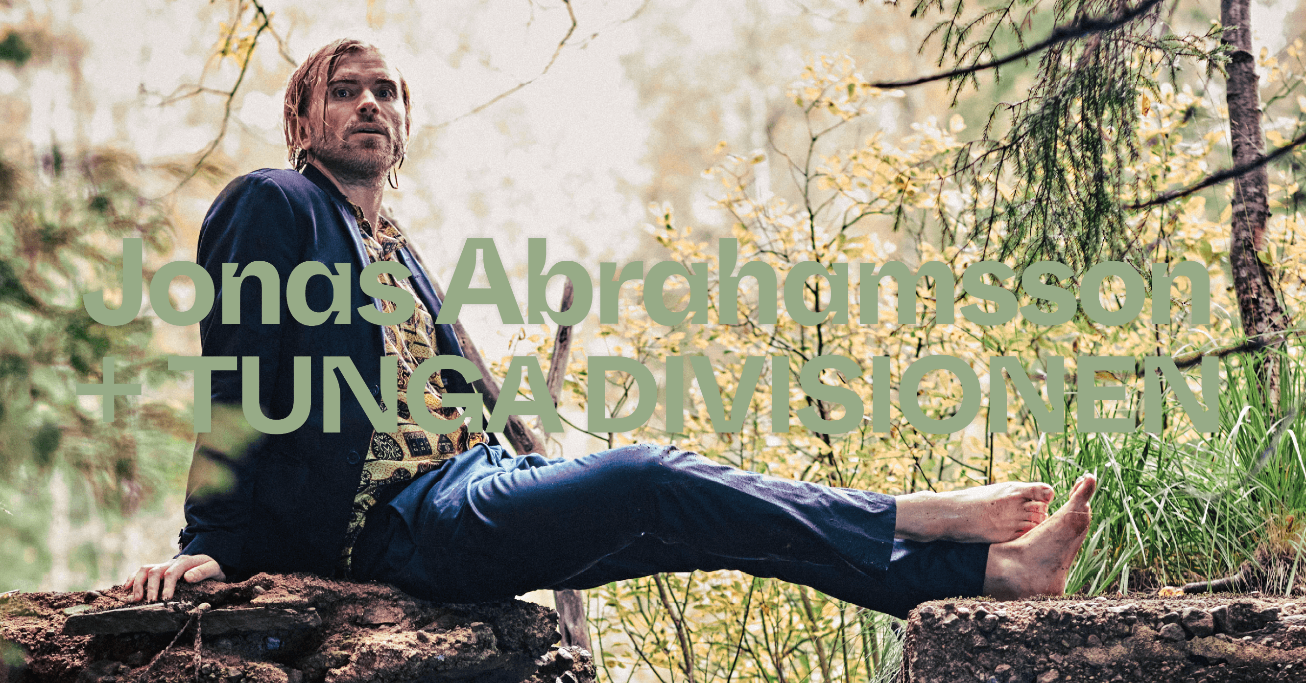 A person sits barefoot on a rock in a forest, with large text overlaying the scene.