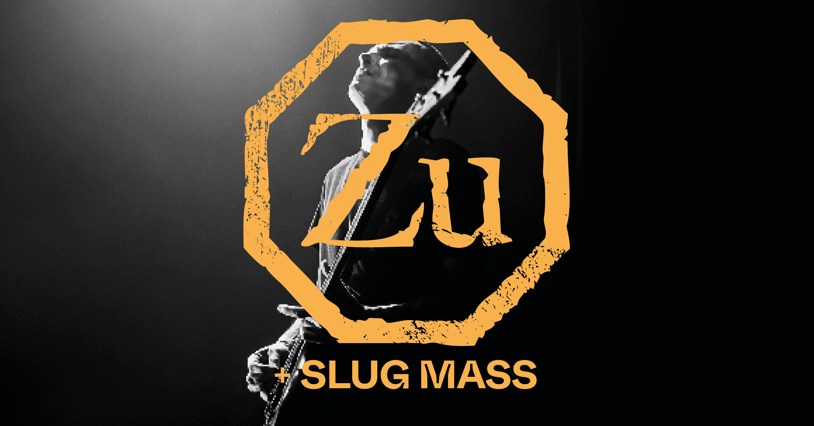 A musician plays a guitar in a dimly lit setting, with the text "Zu + SLUG MASS" overlaid in an orange, distressed font.